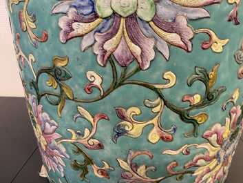A large Chinese famille rose cylindrical vase with molded lotus scrolls, Jiaqing/Daoguang